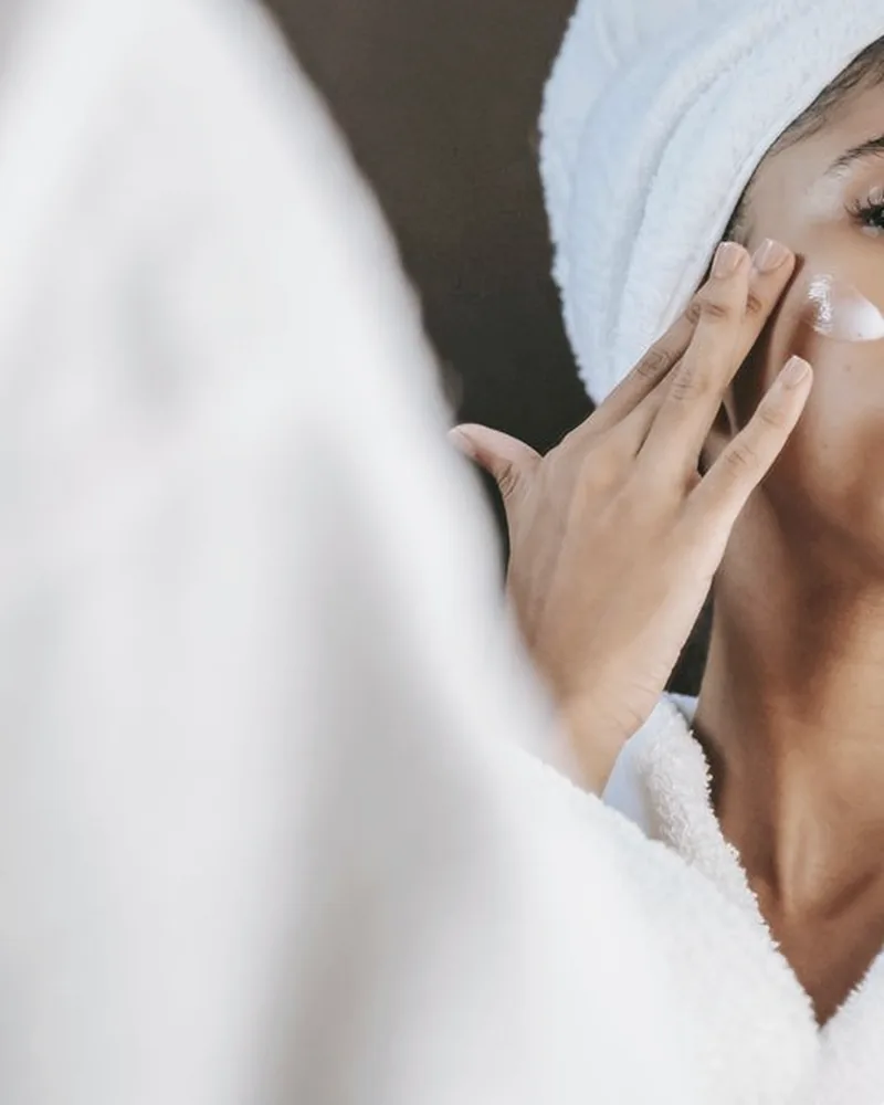 Gentle facial treatment in a bright spa room